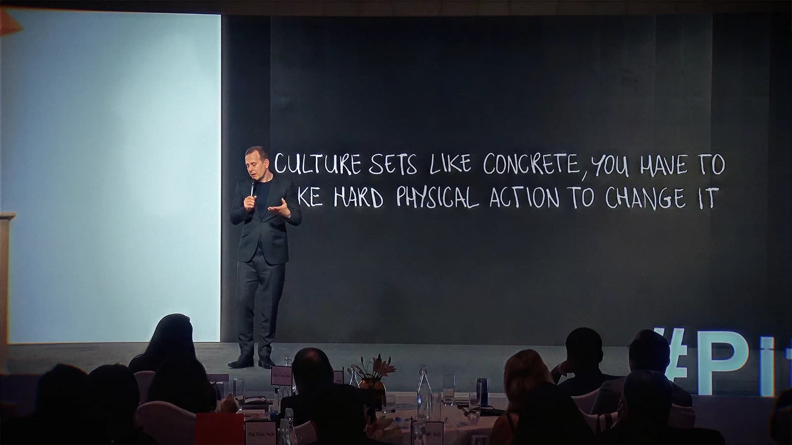 Chris Hirst delivering a leadership keynote on stage
