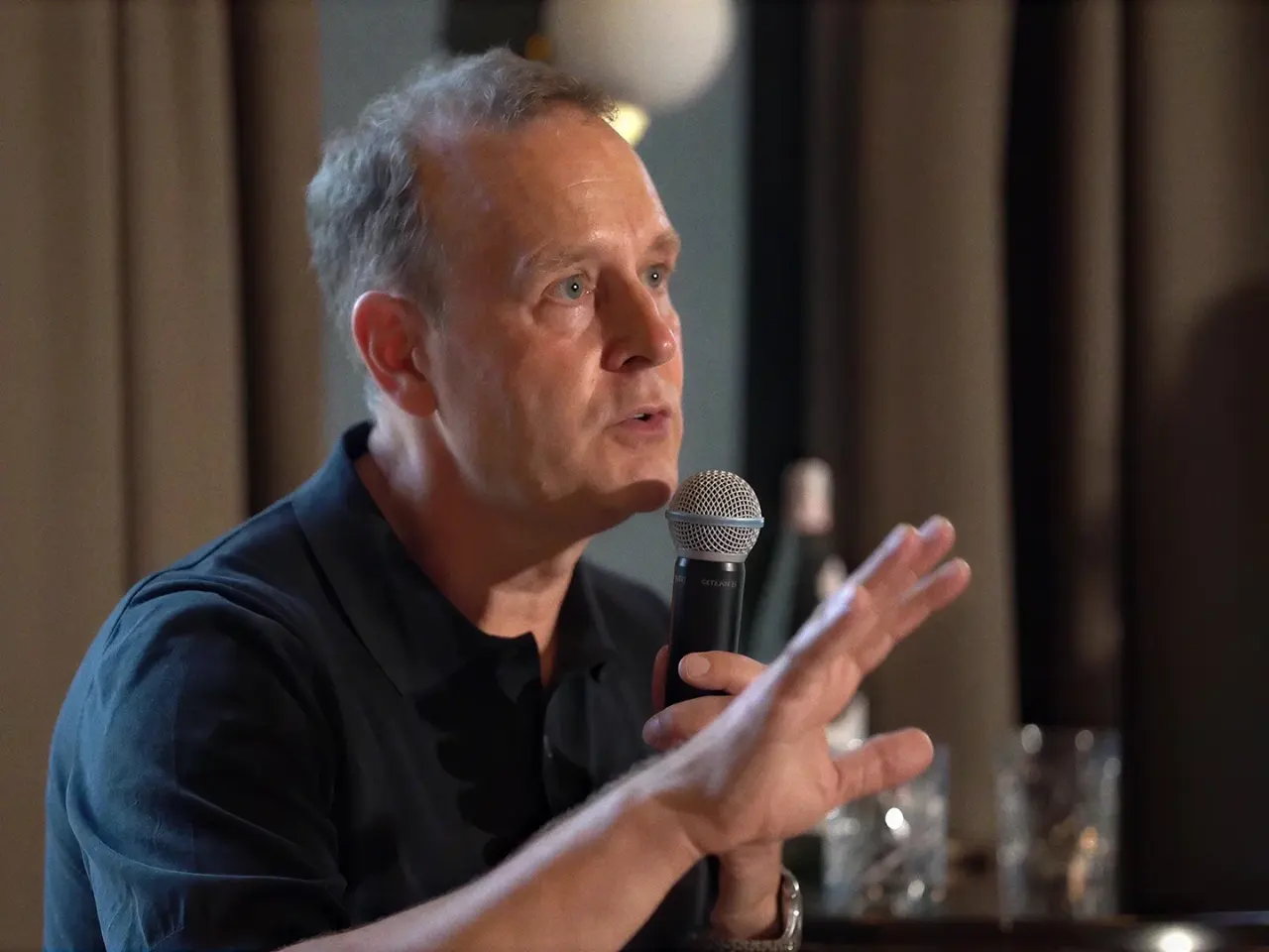 Chris Hirst in a close conversation at a leadership event